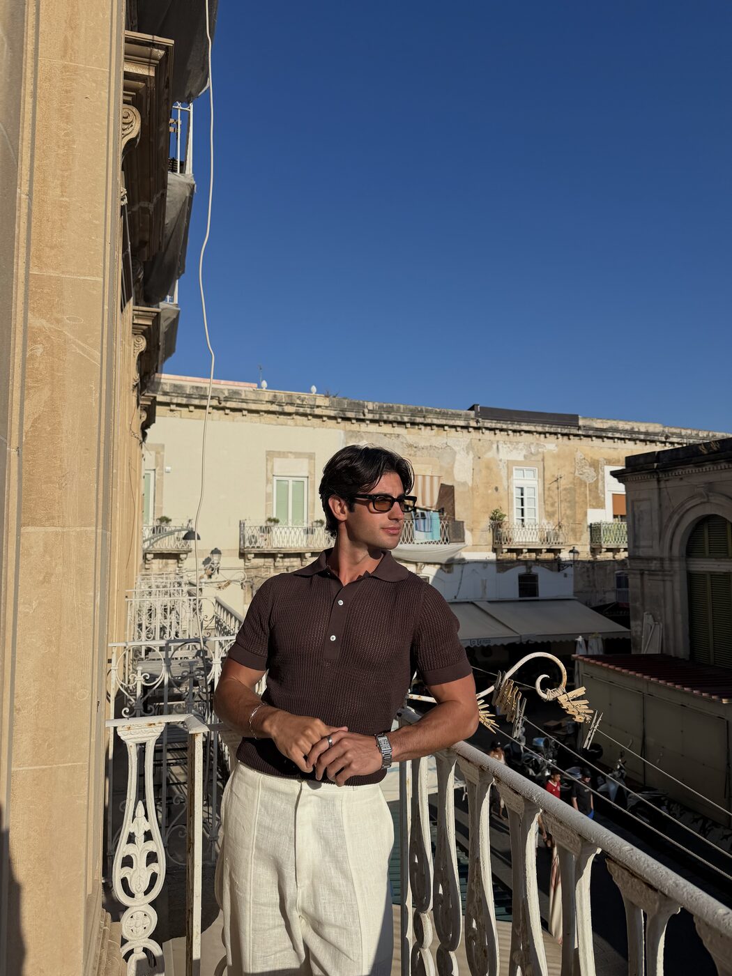 Gio Mineo — polo and linen on a balcony