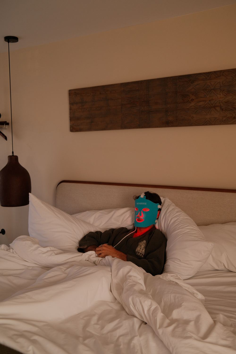 Red light mask in bed at Terra